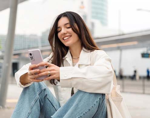 Lady reads something on phone
 
