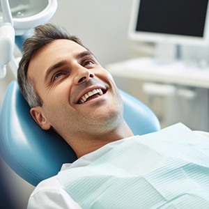 Man smiling and relaxed in the treatment chair